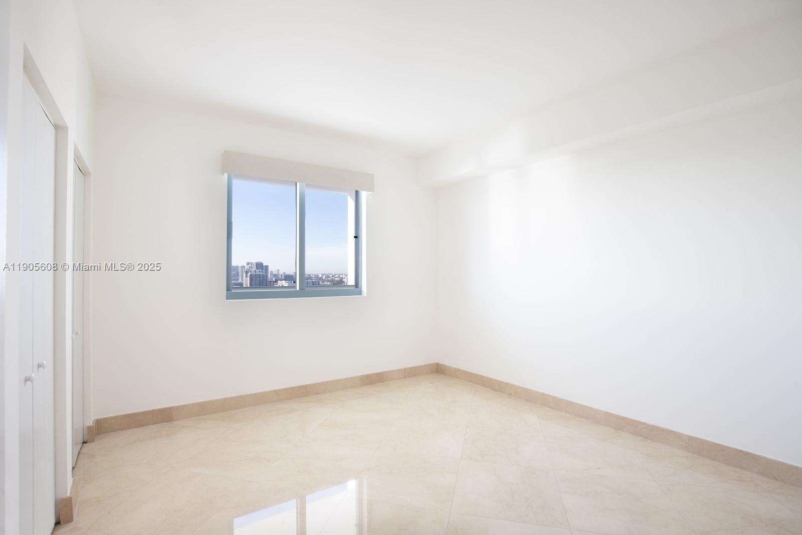 601 Northeast 36th Street, Unit 2304 Miami, FL 33137 - Photo 20 of 40 an empty room with a window