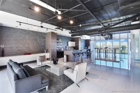 a building outdoor space with patio lots of furniture and a potted plant