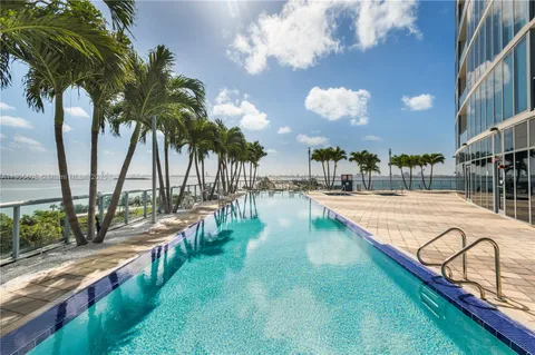 a view of a swimming pool with a patio