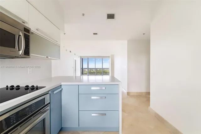 a kitchen with a stove and a microwave