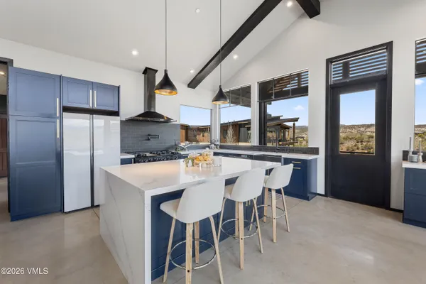 a bathroom with a shower and a sink