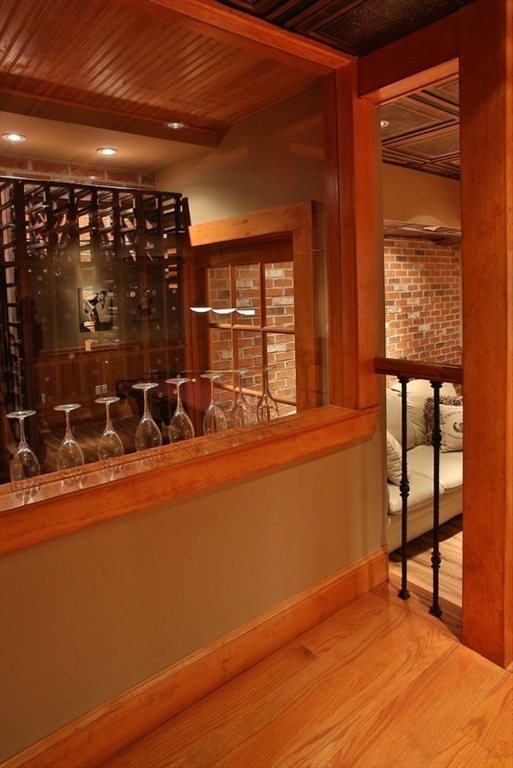 460 Heath Street Brookline, MA 02467 - Photo 19 of 22 a room with wooden floor and furniture