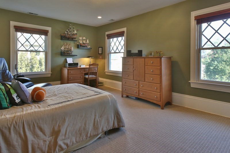 460 Heath Street Brookline, MA 02467 - Photo 21 of 22 a bedroom with a bed and dresser