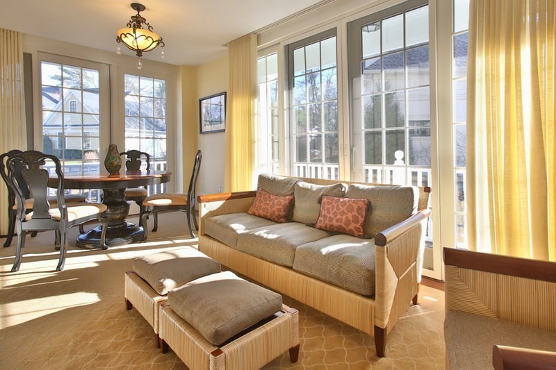 460 Heath Street Brookline, MA 02467 - Photo 5 of 22 a living room with furniture and floor to ceiling windows