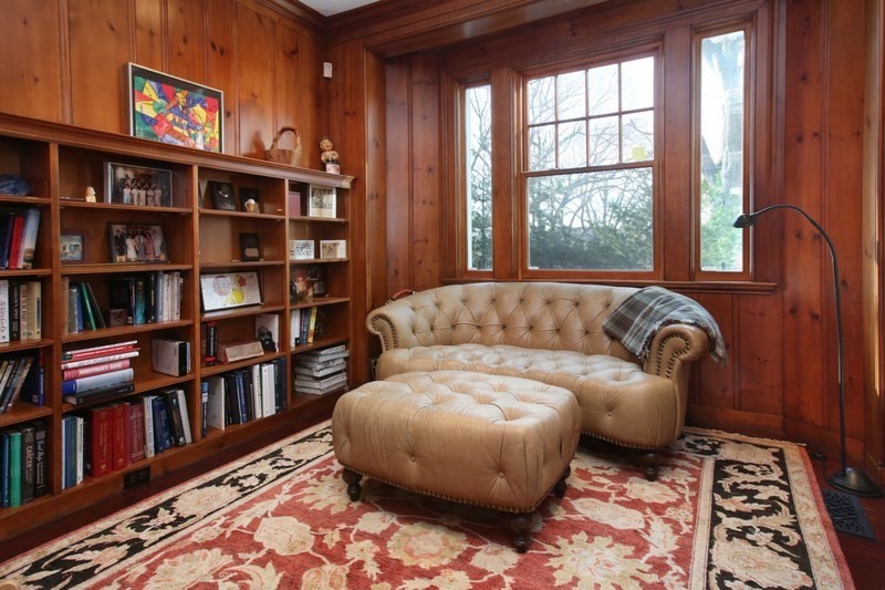 460 Heath Street Brookline, MA 02467 - Photo 10 of 22 a living room with a couch and a book shelf