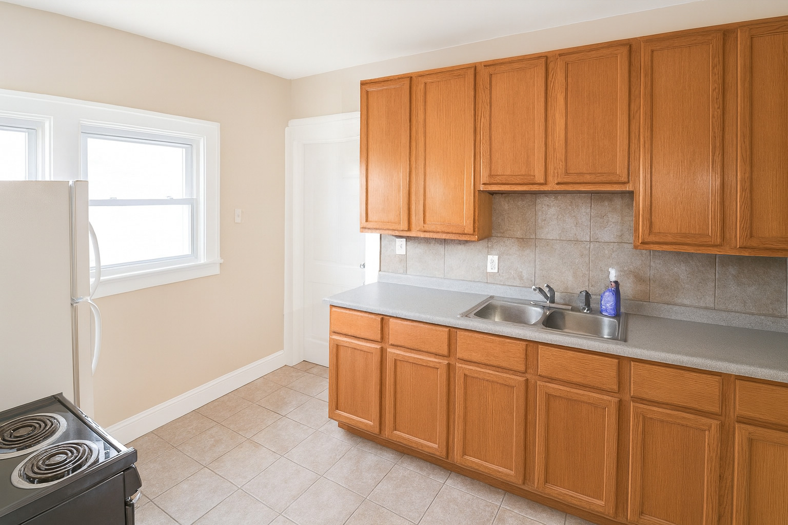 910 Nicholson Street Joliet, IL 60435 - Photo 20 of 30 a kitchen with stainless steel appliances granite countertop a sink a stove and cabinets