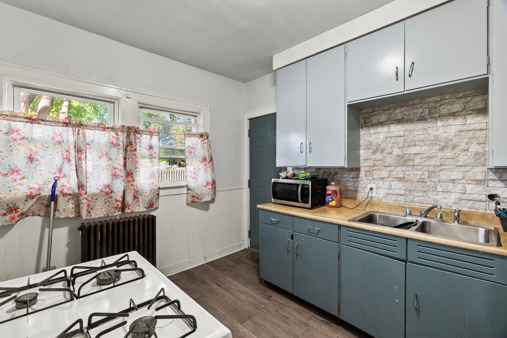 910 Nicholson Street Joliet, IL 60435 - Photo 8 of 30 a kitchen with stainless steel appliances a sink stove and cabinets