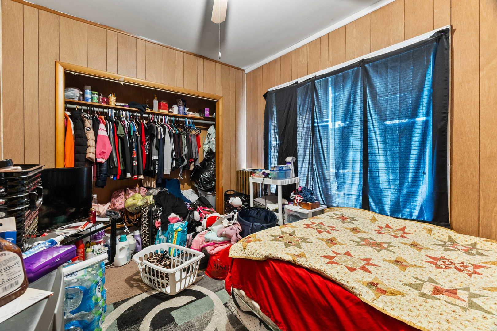 910 Nicholson Street Joliet, IL 60435 - Photo 10 of 30 a bed room with a bed a closet and a closet