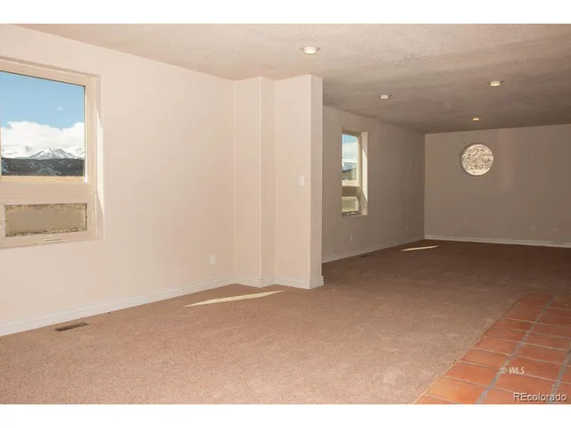 a view of a hallway with a white walls