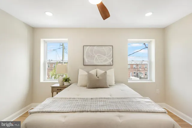 a bedroom with a large bed and a window