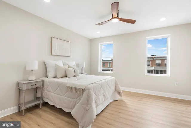 a bedroom with a large bed and a window