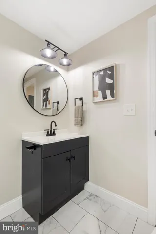 a bathroom with a sink and mirror