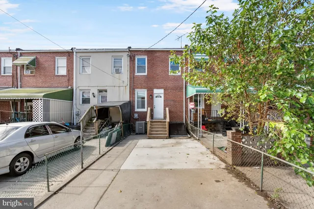 a view of a car park in front of a building