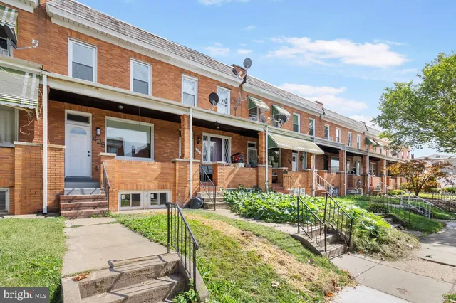 front view of a building with a yard