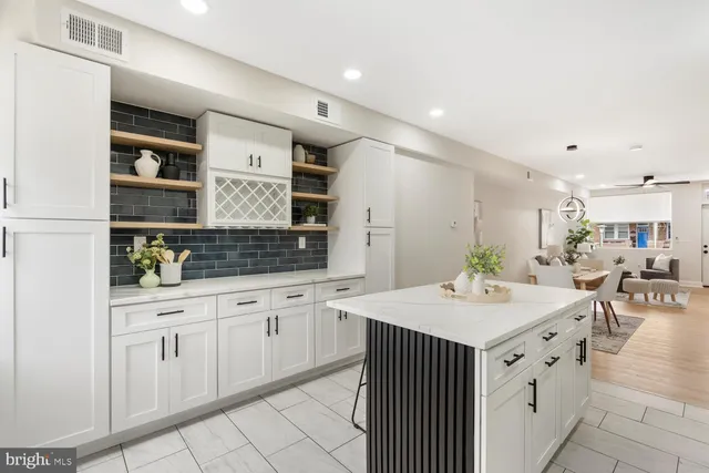 a kitchen with a sink dishwasher and cabinets