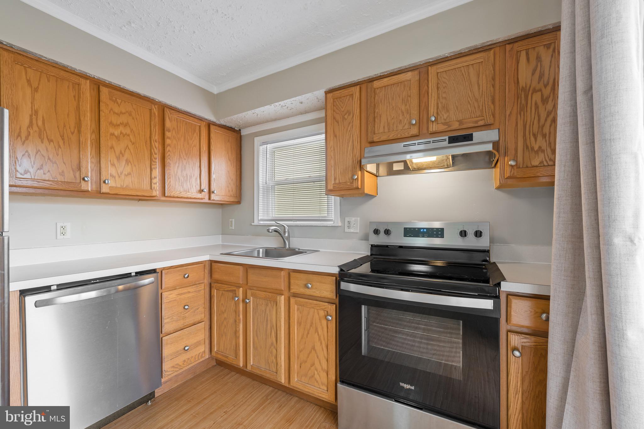 163 East 2nd Street Alburtis, PA 18011 - Photo 18 of 30 a kitchen with a sink stove and cabinets
