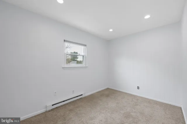 an empty room with closet area