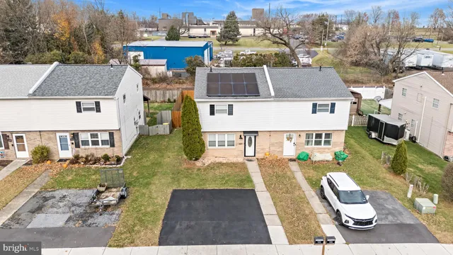 an aerial view of a house with swimming pool