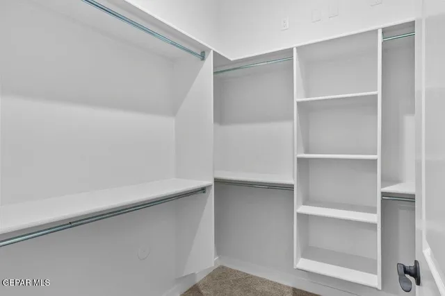 a view of an empty walk in closet