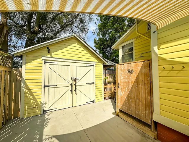 a view of a house with a wooden deck