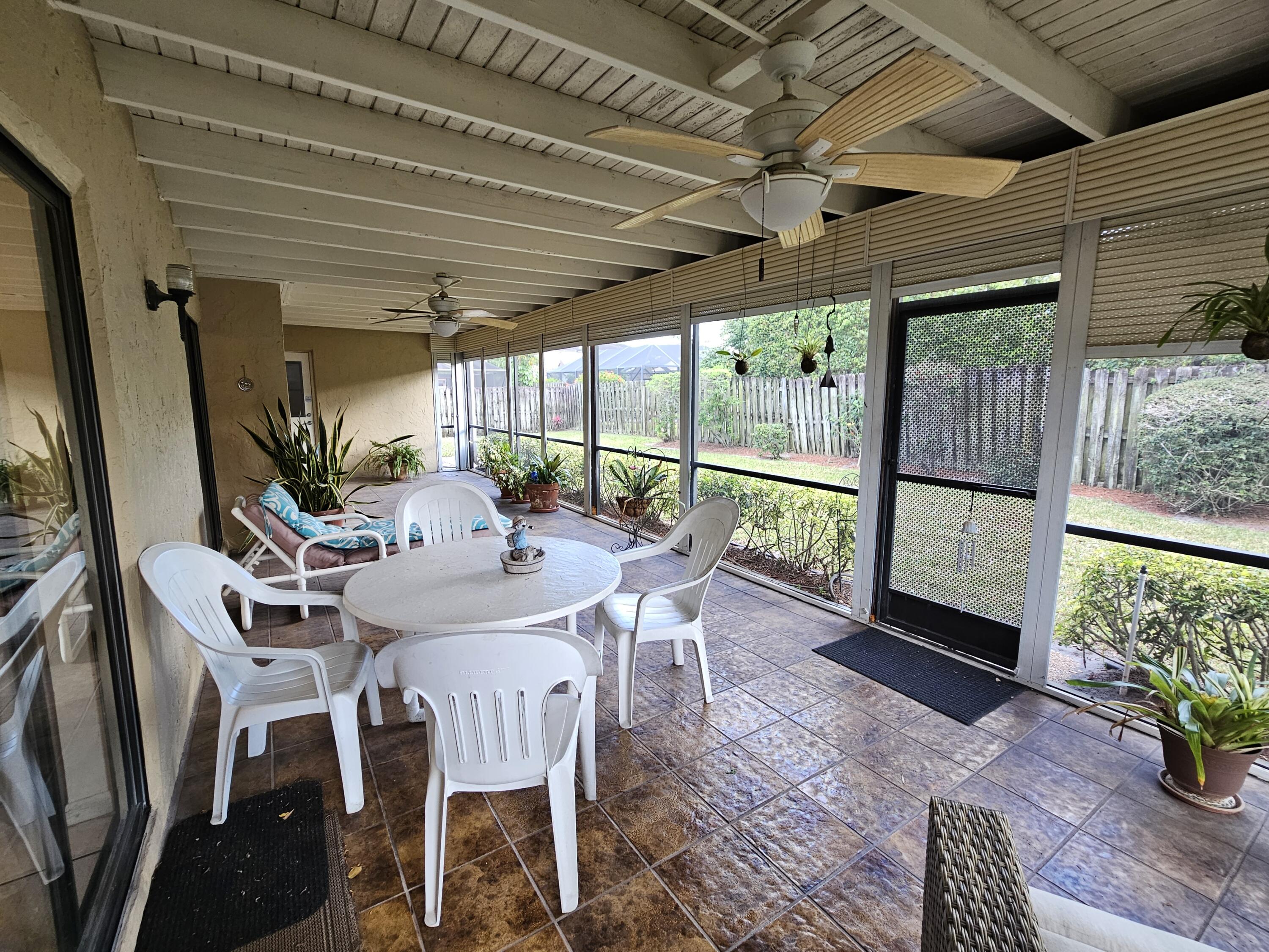 22171 Hollyhock Trail Boca Raton, FL 33433 - Photo 14 of 19 a view of a dining room with furniture window and outside view