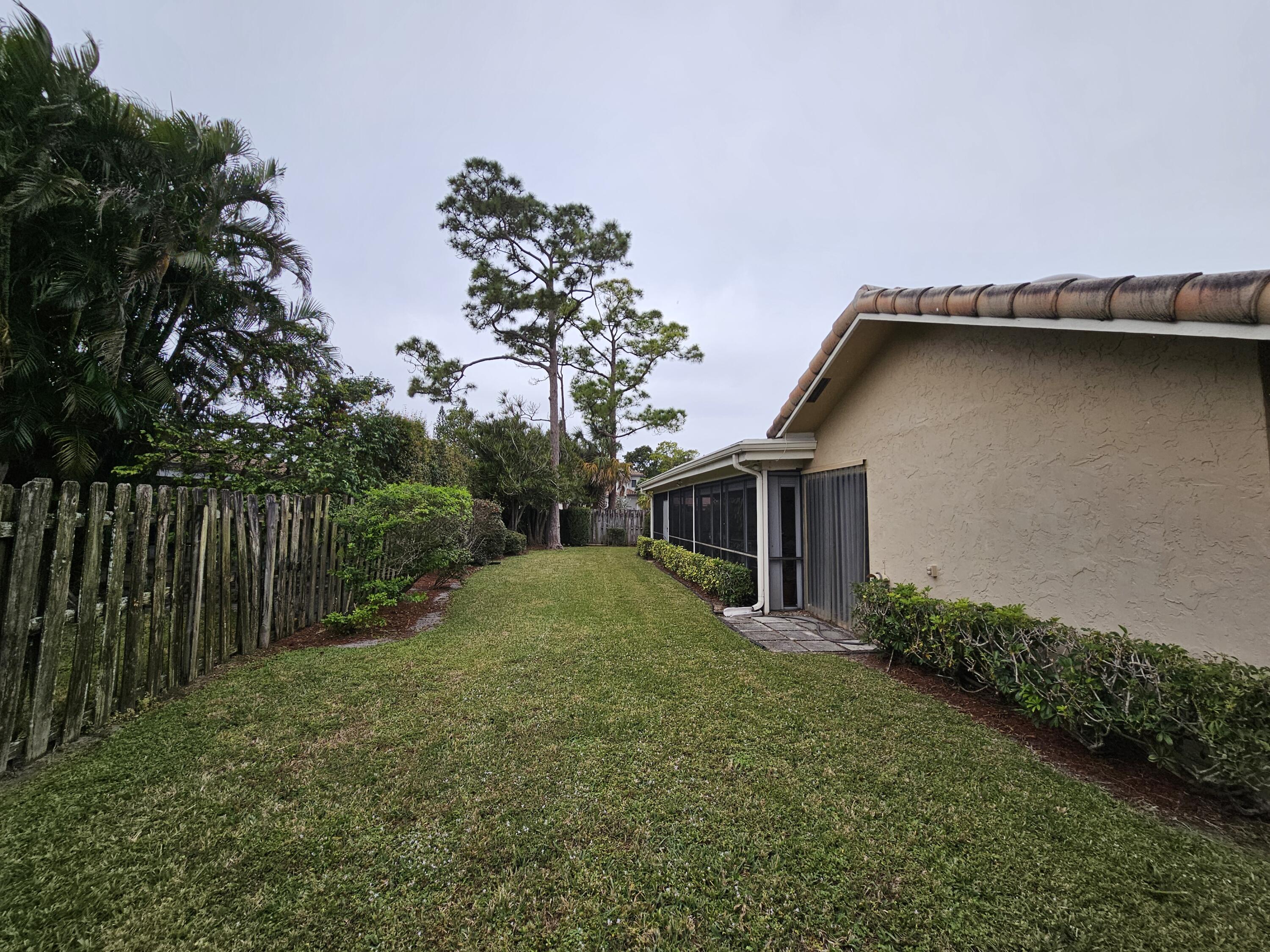 22171 Hollyhock Trail Boca Raton, FL 33433 - Photo 16 of 19 a backyard of a house with lots of green space