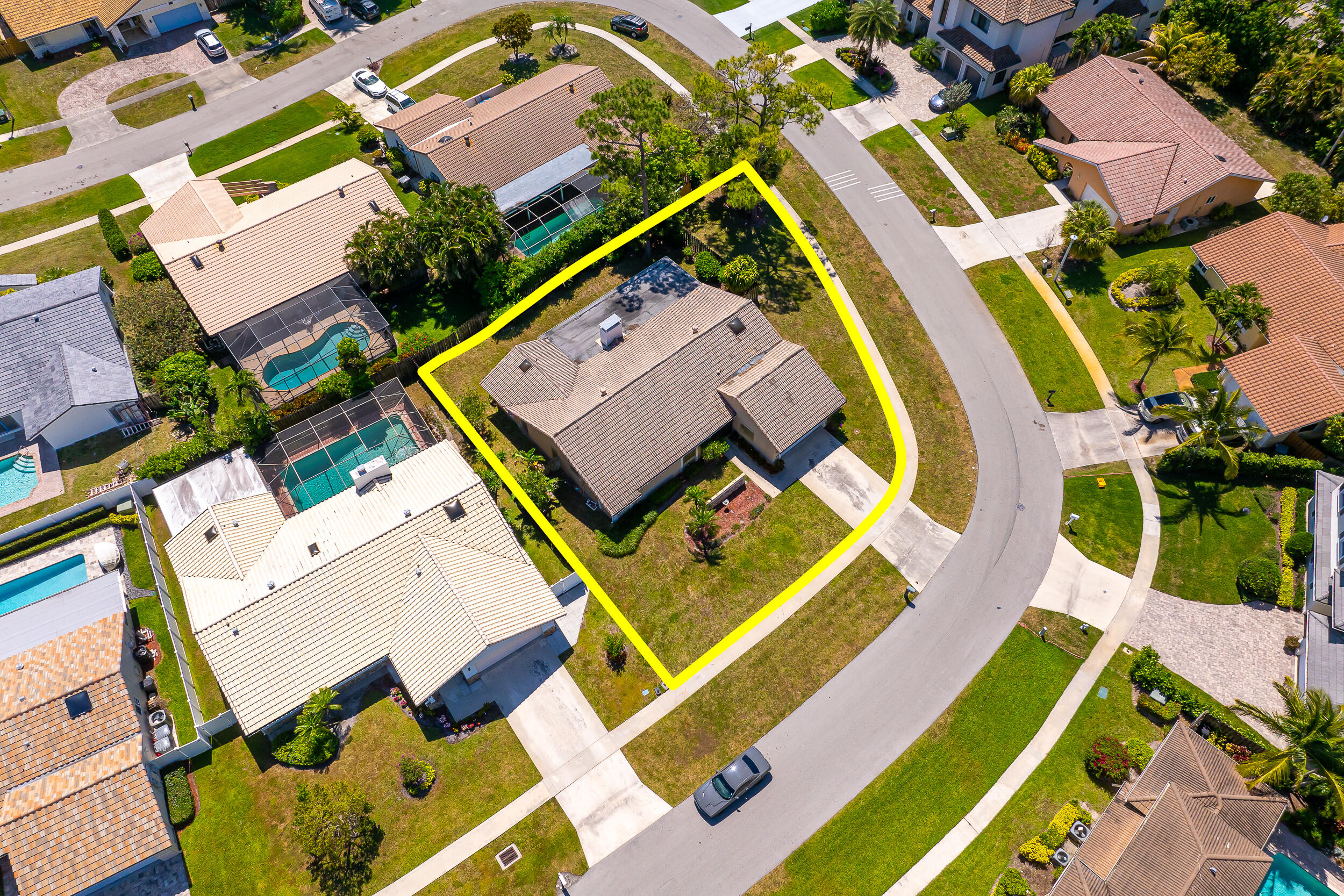 22171 Hollyhock Trail Boca Raton, FL 33433 - Photo 19 of 19 an aerial view of a house with a big yard and potted plants
