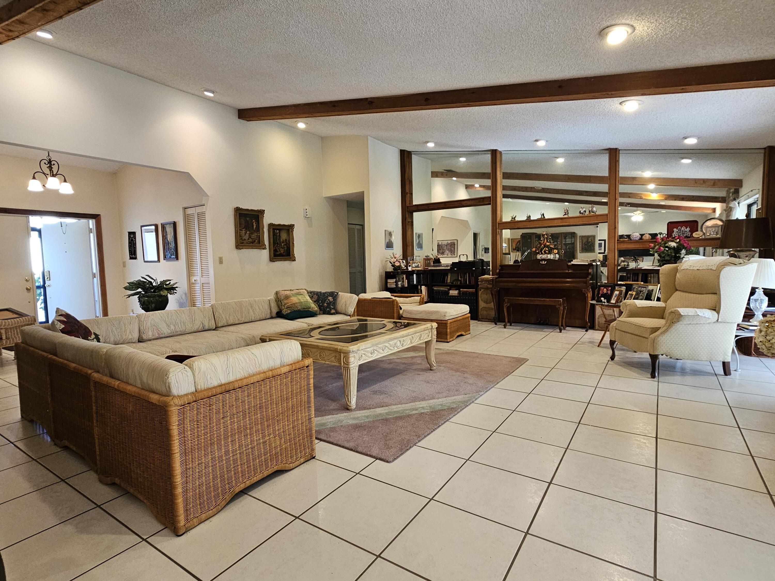 22171 Hollyhock Trail Boca Raton, FL 33433 - Photo 4 of 19 a living room with furniture and a flat screen tv