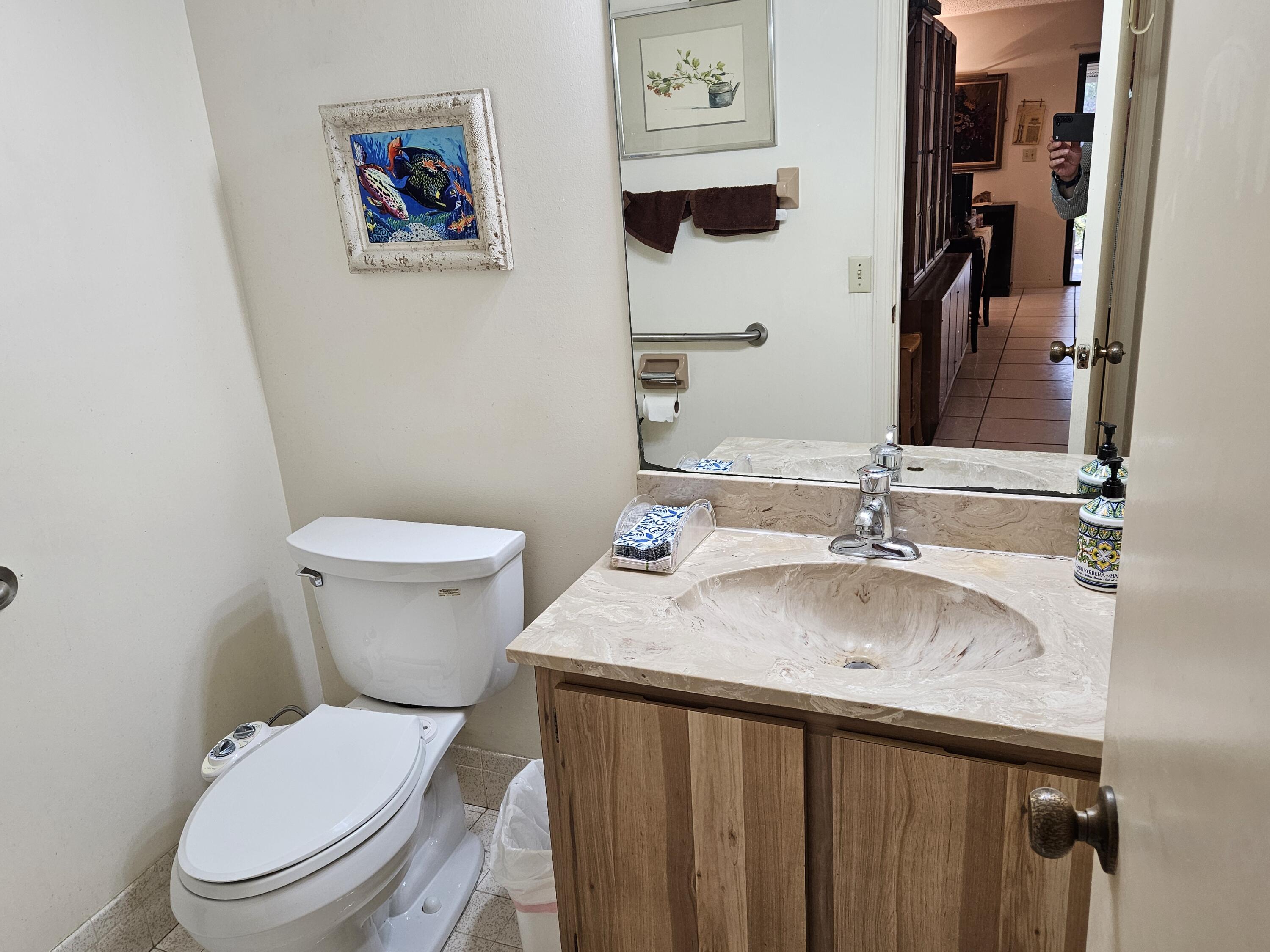 22171 Hollyhock Trail Boca Raton, FL 33433 - Photo 8 of 19 a bathroom with a sink and a toilet