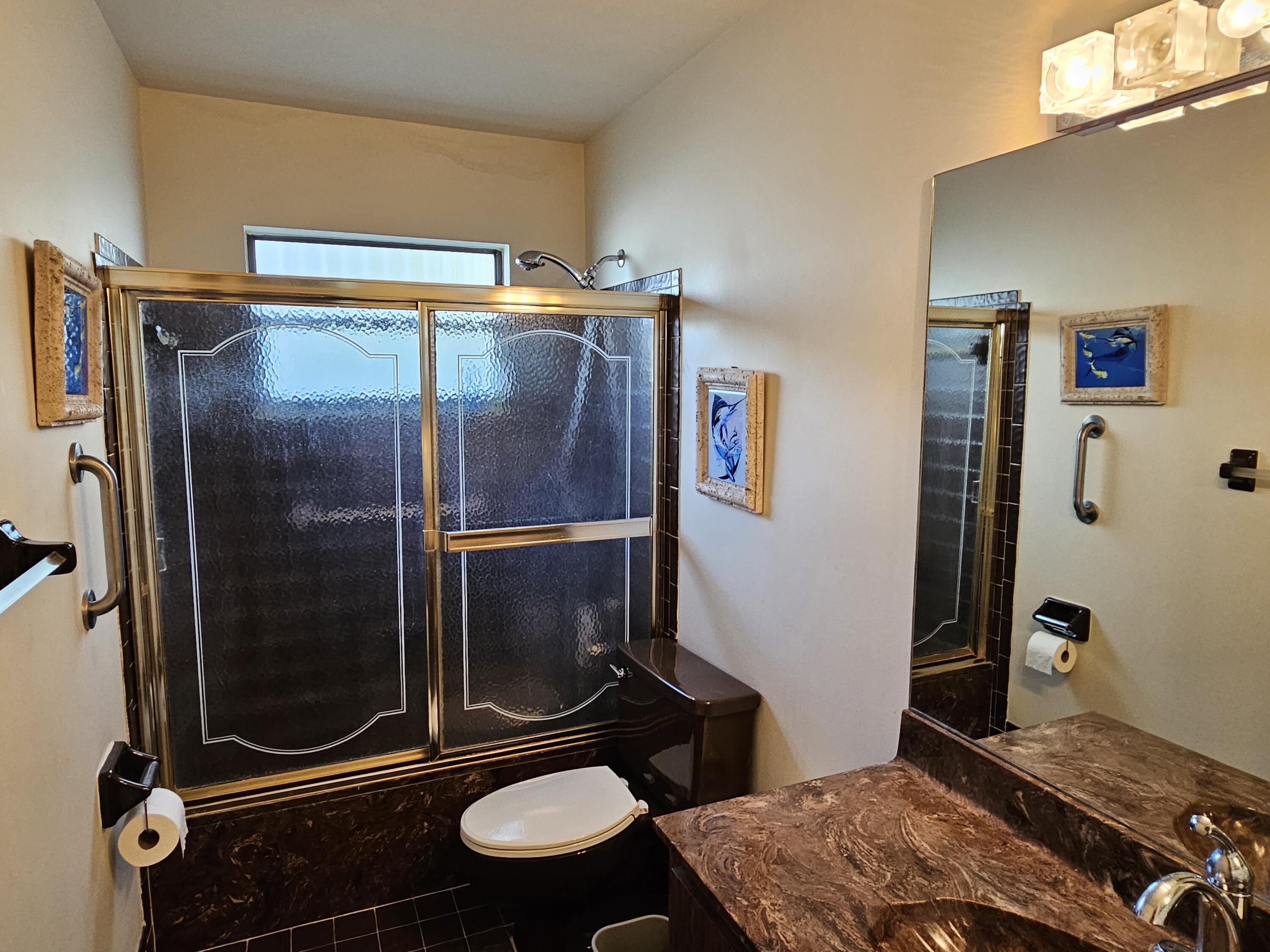 22171 Hollyhock Trail Boca Raton, FL 33433 - Photo 10 of 19 a bathroom with a sink toilet and shower