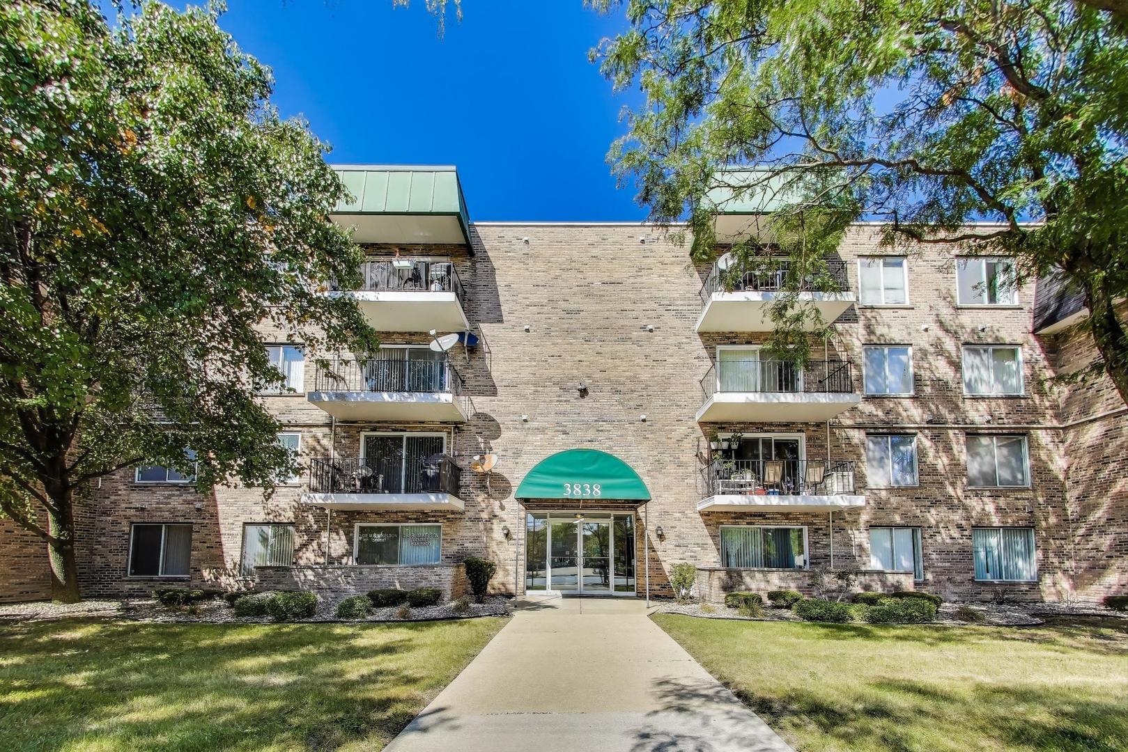 a front view of a building with garden