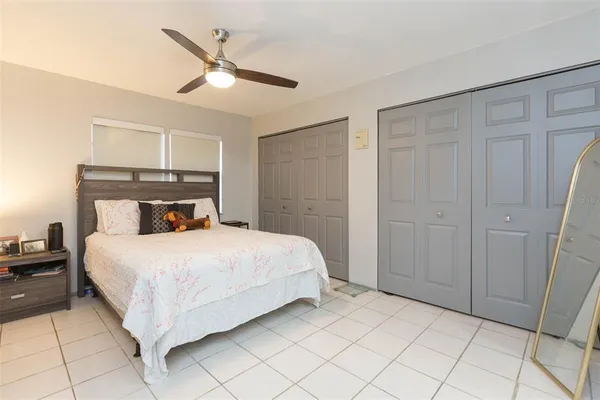 a bedroom with a bed and a lamp