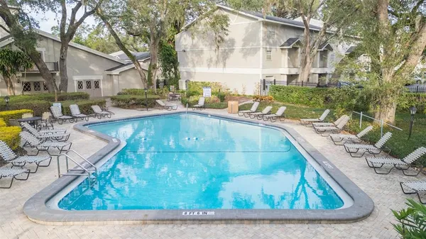a view of a swimming pool with a patio