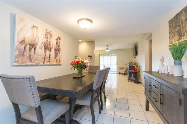 a dining room with furniture and window