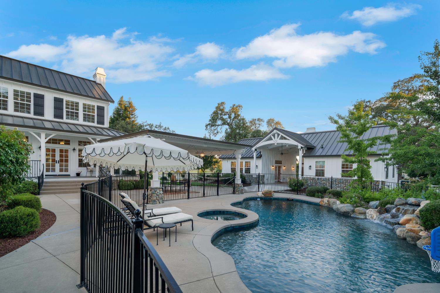 2905 Virginiatown Road Lincoln, CA 95648 - Photo 42 of 86 Outdoor oasis featuring a freeform swimming pool with integrated spa and rock waterfall