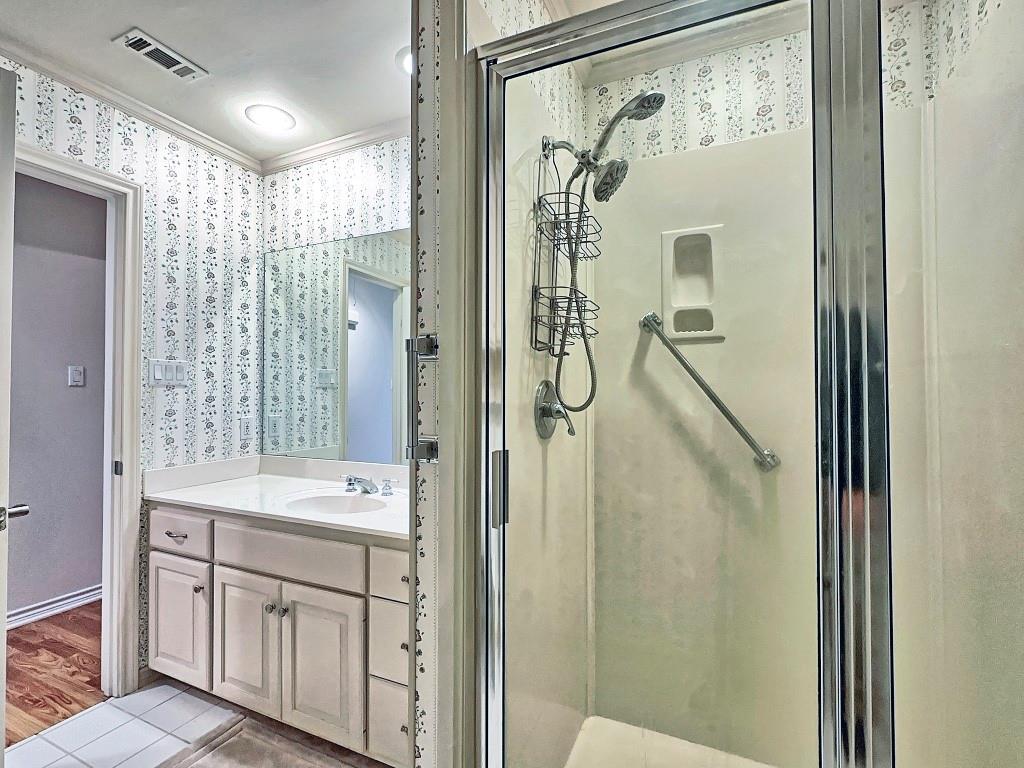 810 Toribrooke Athens, TX 75751 - Photo 13 of 18 a bathroom with a double vanity sink mirror and shower