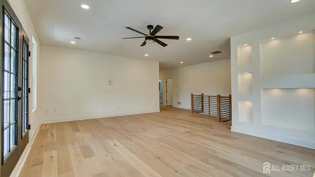 a bathroom with a double vanity sink mirror and shower