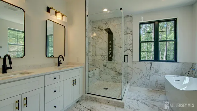 a bathroom with a bathtub and shower