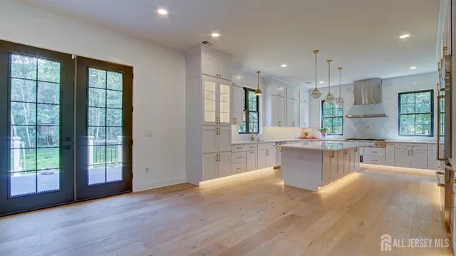a bathroom with a double vanity sink mirror and shower