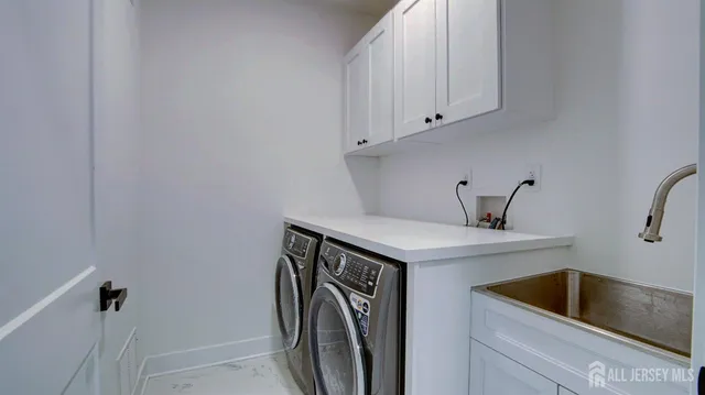 a large kitchen with a large window and stainless steel appliances