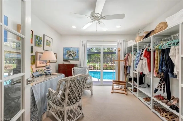 a view of a livingroom with furniture hardwood floor and a chandelier