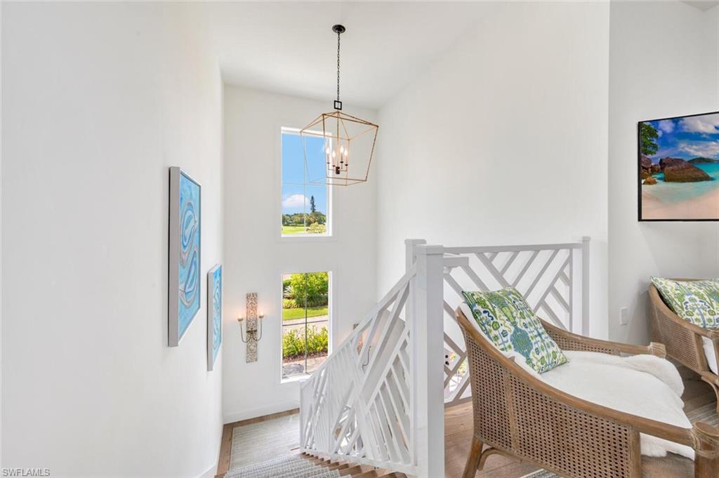 200 Burning Tree Drive Naples, FL 34105 - Photo 29 of 48 a living room with furniture and a table