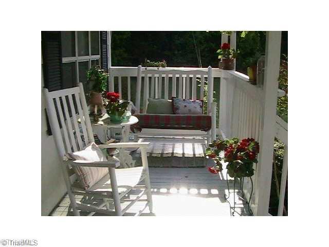 7926 Highfill Road Summerfield, NC 27358 - Photo 2 of 6 Exterior Front. Feet up and Relax on the Front Porch. Watch your horses graze or read a good book.