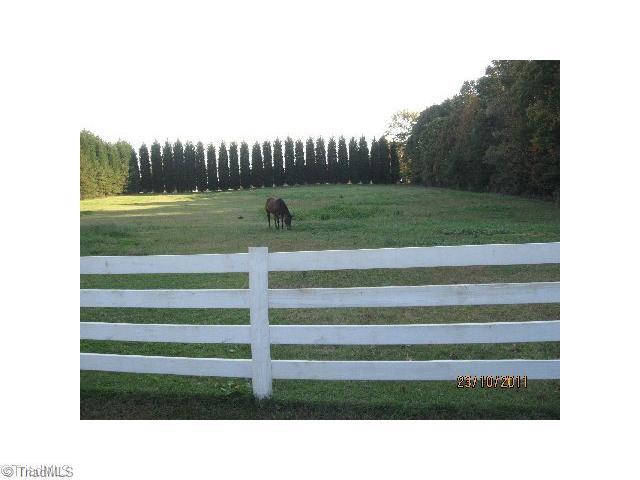 7926 Highfill Road Summerfield, NC 27358 - Photo 4 of 6 Land/Lot. Large Fenced Field 3-4 acres bound by mature trees.