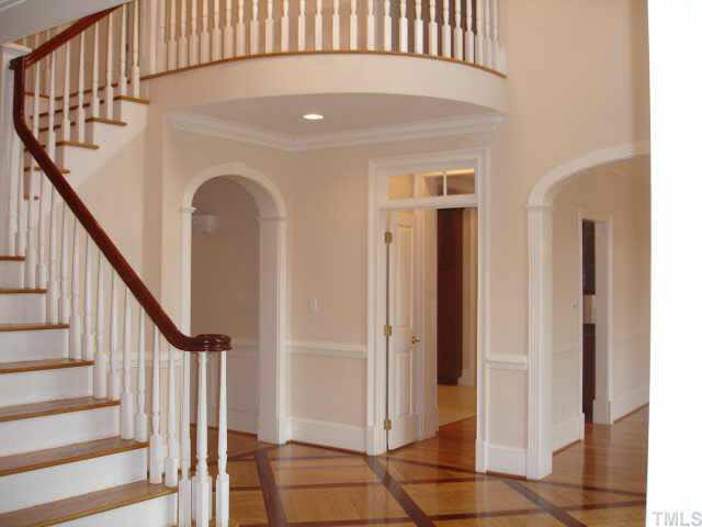 1412 Ridge Side Place Raleigh, NC 27613 - Photo 2 of 10 Dramatic two story foyer with curved staircase, newly re-finished hardwood floors Other