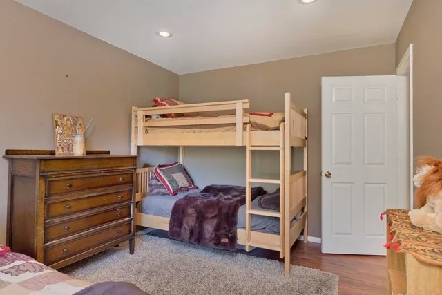 a bed room with a bed and a window