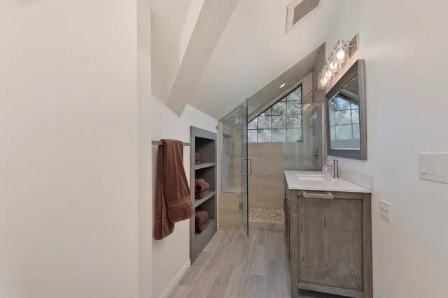 a bathroom with a sink and mirror