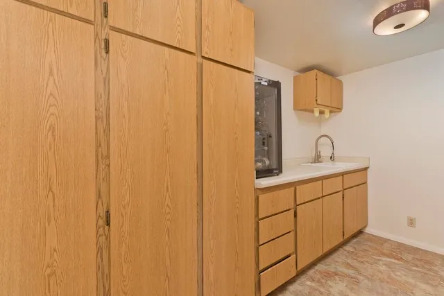a bathroom with a double vanity sink and mirror