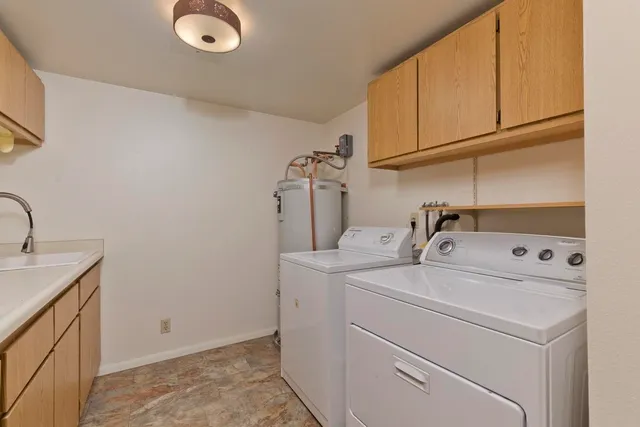 a utility room with dryer and washer
