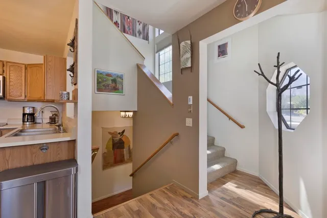 a view of entryway and hall with wooden floor